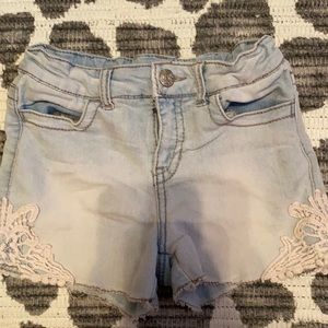 Light wash Cherokee jean shorts with lace